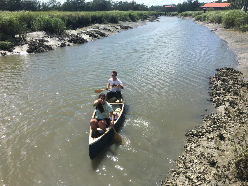 students paddling