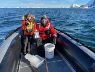 Image: Patricia Medeiros and Renato Castelao aboard a Zodiac boat collecting samples.