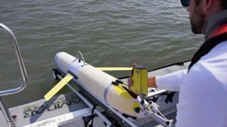 Glider team member Ben Hefner prepares to launch a glider