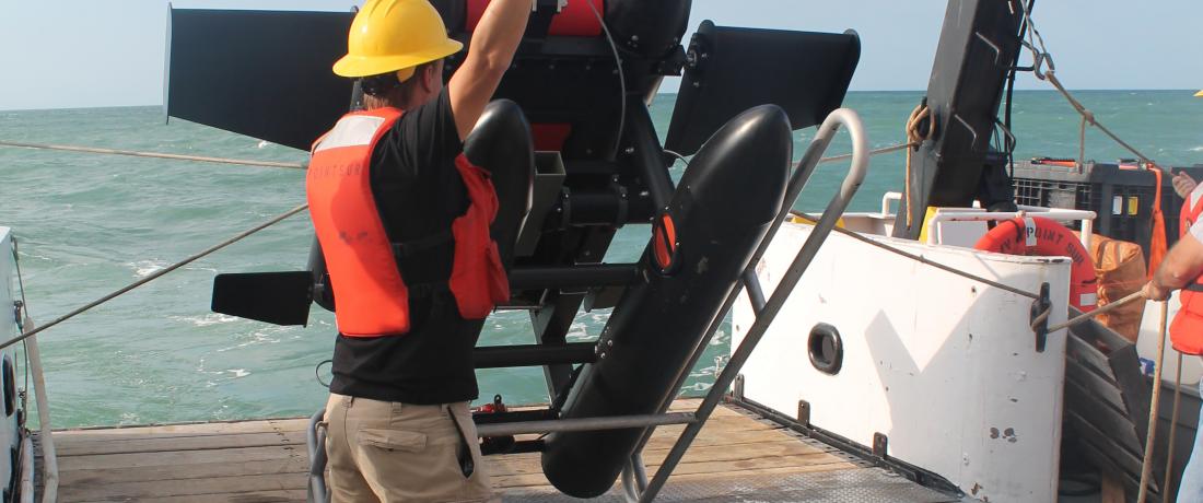 A specialized imaging system for viewing zooplankton is launched from a research vessel.