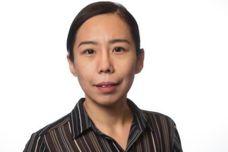 Dr. Jianqiu Zheng smiles in a headshot framed by a white background. She is wearing a brown and black vertical stripe button up