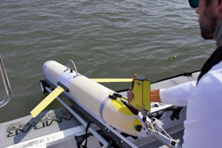 Glider team member Ben Hefner prepares to launch a glider